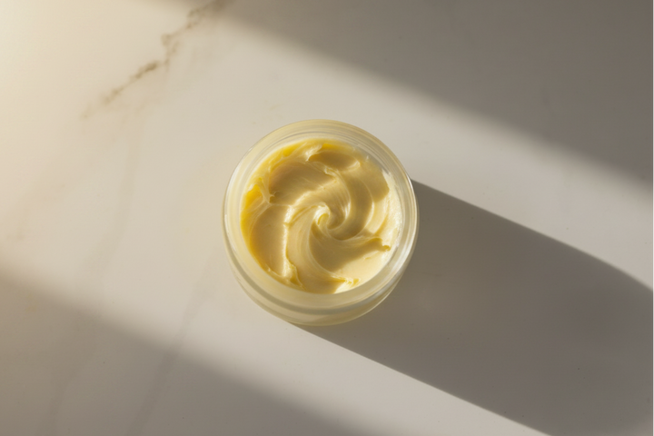 Natural styling pomade with shea butter botanical oils and beeswax for textured hair